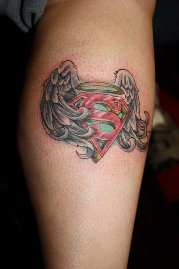 superman logo tattoo on neck